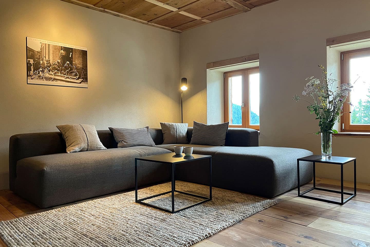 The living room, wood ceiling and a soft sectional