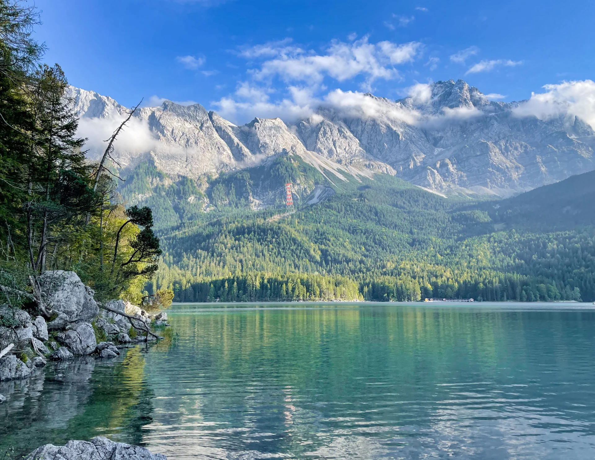 Eibsee lake with turquoise water and the Zugspitze massif behind it